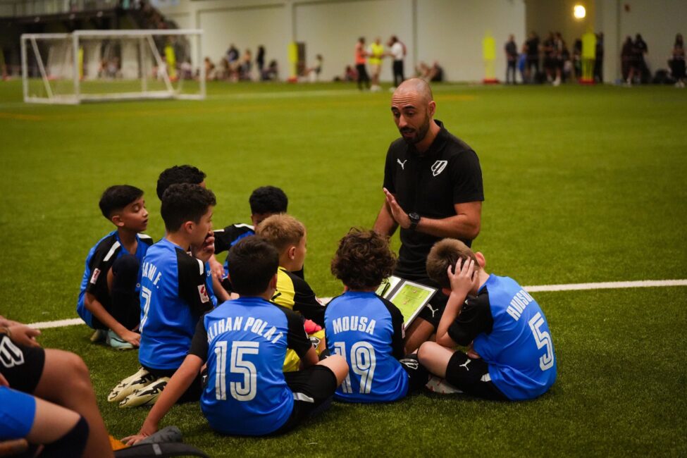 A LaLiga Academy Dubai Coach preparing his team for a match against Ajax Academy Dubai