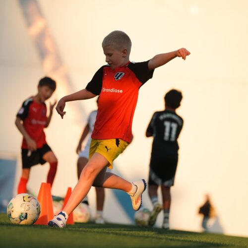A young boy at a football training camp in LaLiga Academy Dubai in Dubai Sports City
