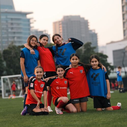 a group of young girls in a football camp in dubai sports city at laliga academy dubai